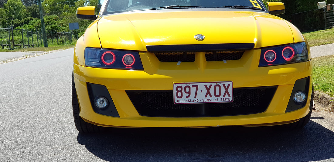 Holden VZ Commodore Projector Headlights with Multicolored Halo Rings and Demon Eyes - Dan's Custom Car Lights