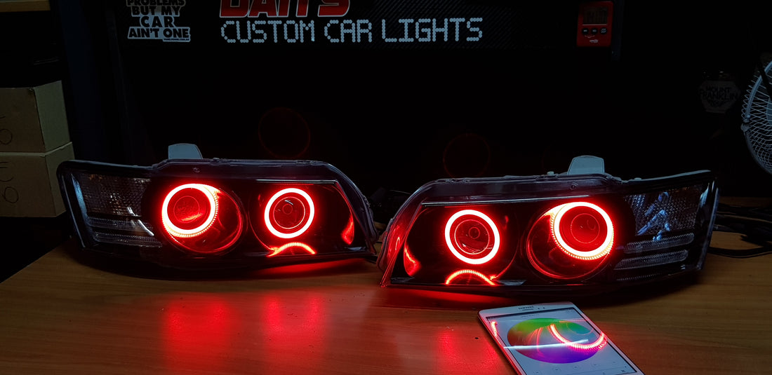 Holden VZ Commodore Projector Headlights with Multicolored Halo Rings and Demon Eyes - Dan's Custom Car Lights
