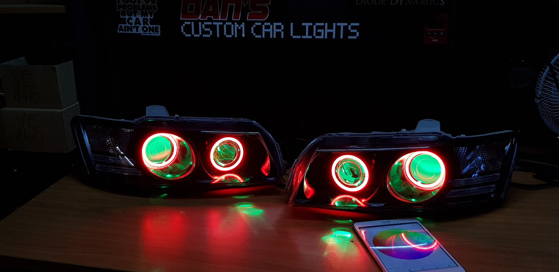 Holden VZ Commodore Projector Headlights with Multicolored Halo Rings and Demon Eyes - Dan's Custom Car Lights