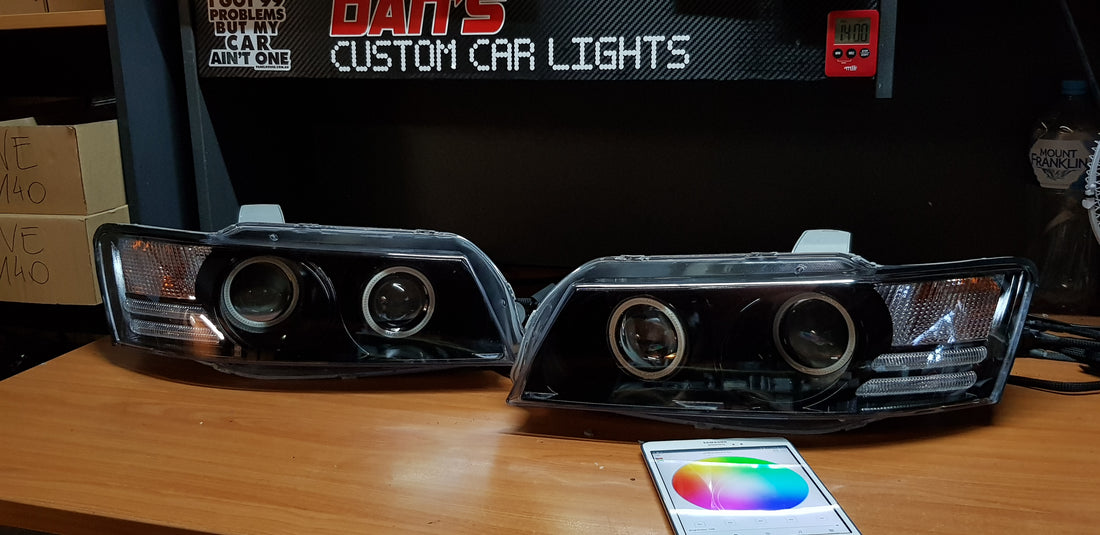 Holden VZ Commodore Projector Headlights with Multicolored Halo Rings and Demon Eyes - Dan's Custom Car Lights