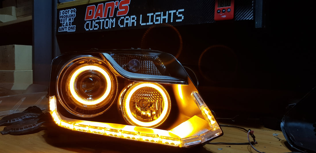 Volkswagen VW Amarok 2010-2022 Headlights with Low Beam LED Projectors, Switchback White/Amber LED Halo rings, and Sequential DRL - Dan's Custom Car Lights