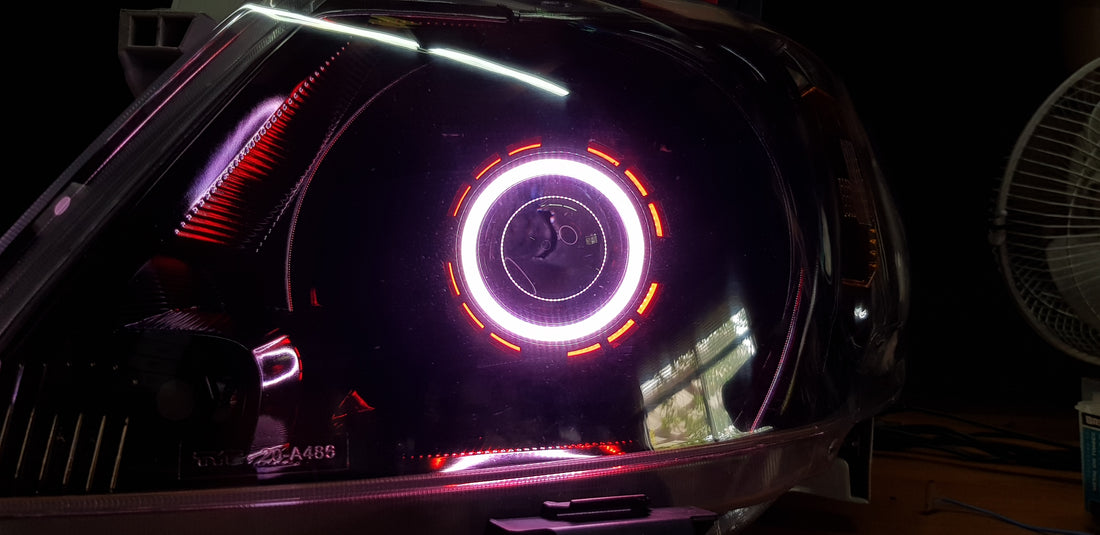 Toyota Hilux 2005 -2015 with Projectors and Dual Multicoloured Halo Rings - Dan's Custom Car Lights