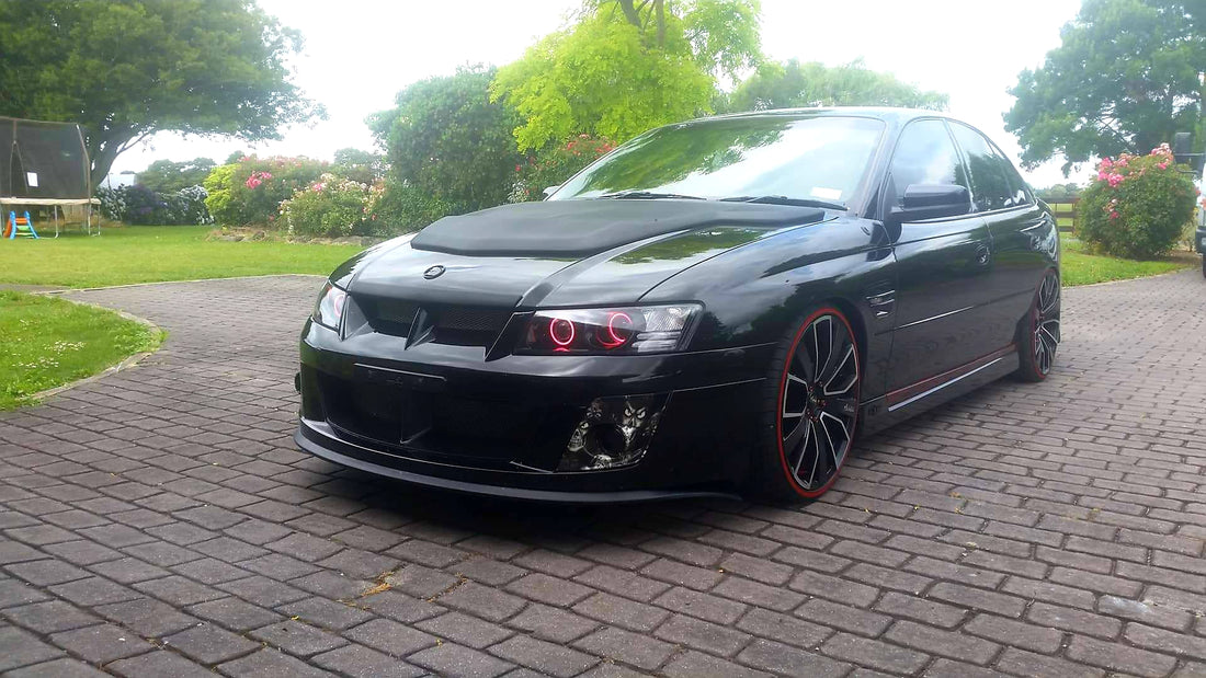 Holden VZ Commodore fitted with Quad Projectors and Multicolored Halo Ring - Dan's Custom Car Lights