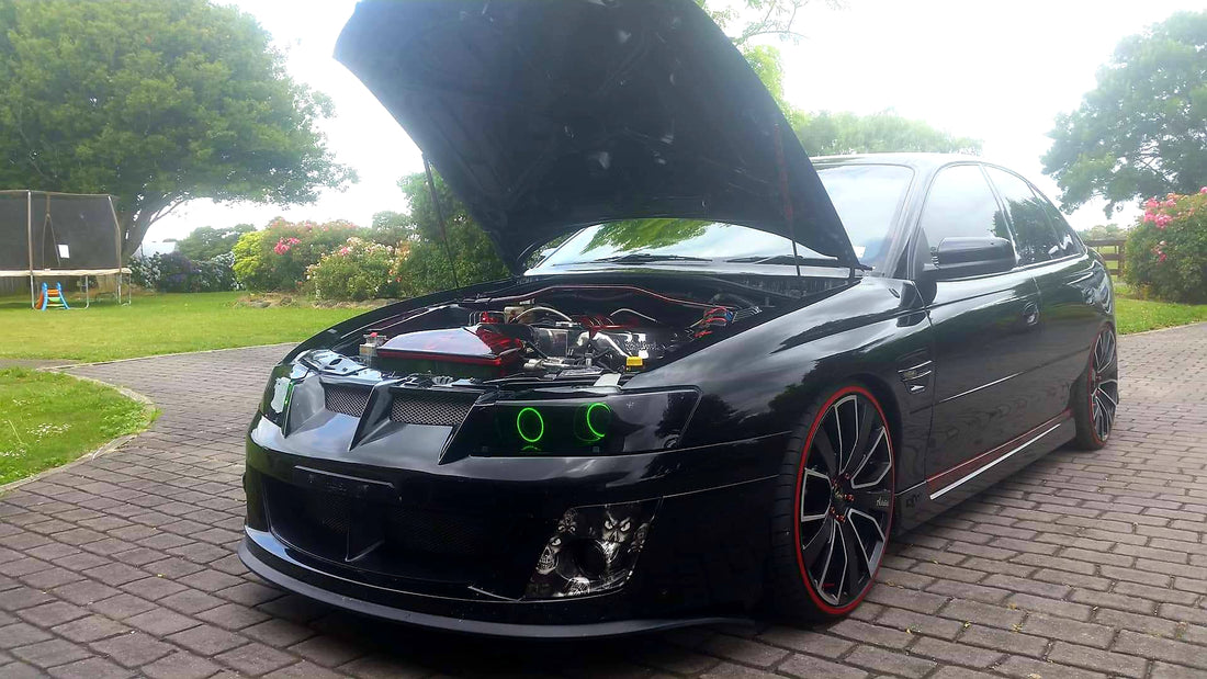Holden VZ Commodore fitted with Quad Projectors and Multicolored Halo Ring - Dan's Custom Car Lights