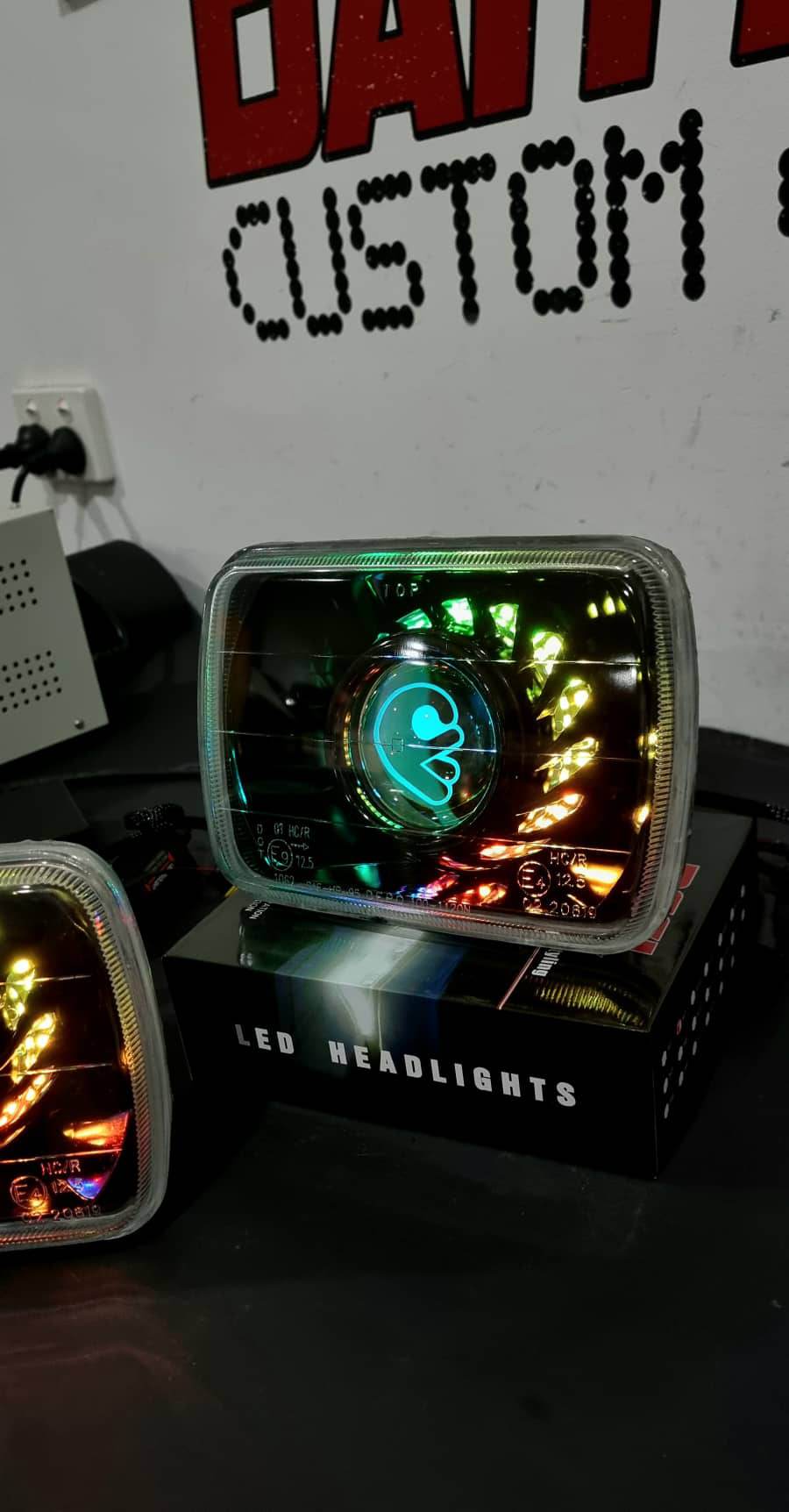 UNIVERSAL 5X7" RECTANGLE HEADLIGHTS FITTED WITH BI PROJECTORS, TURBINE SHROUD WITH CHASING MULTICOLORED HALO RINGS INSIDE & FULL BLACKING OUT - Dan's Custom Car Lights 