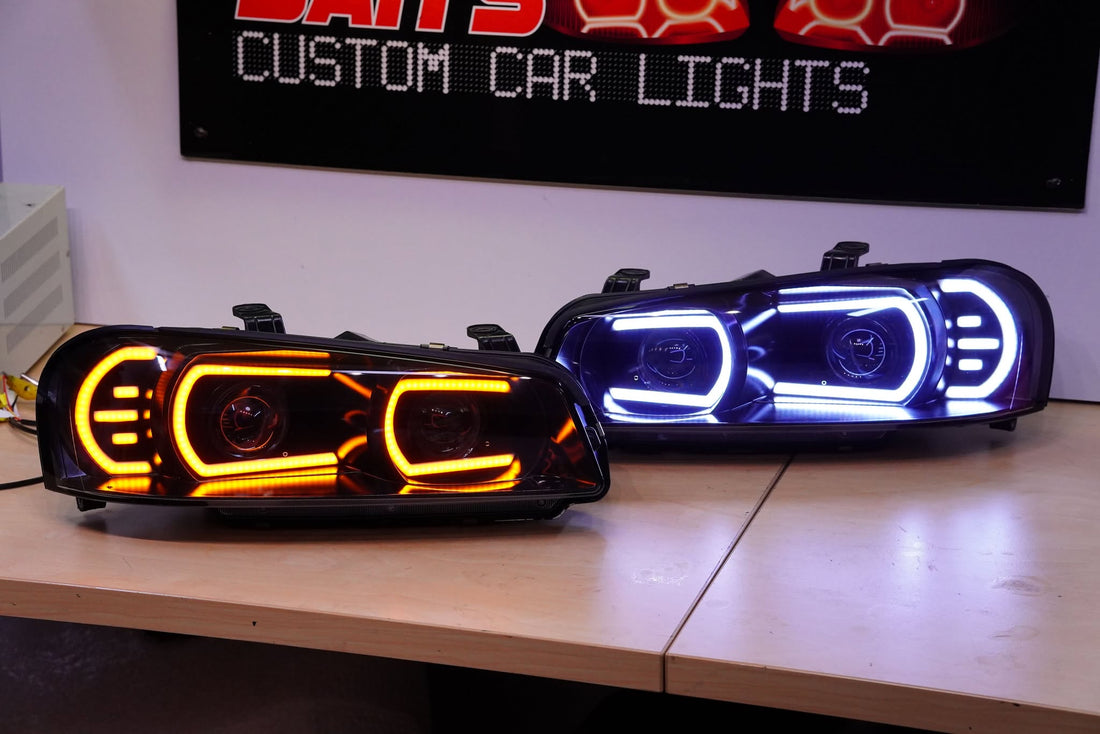 Genuine Nissan Skyline R34 GT & GT-T Headlights with White/Amber DRLs and Projectors