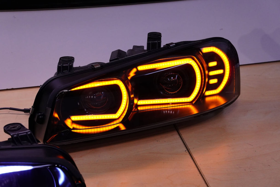 Genuine Nissan Skyline R34 GT & GT-T Headlights with White/Amber DRLs and Projectors