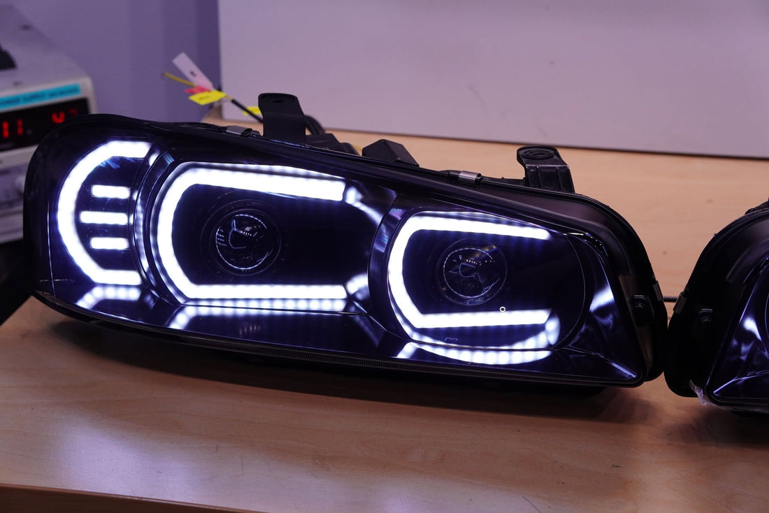 Genuine Nissan Skyline R34 GT & GT-T Headlights with Multicoloured Chasing DRLs and Projectors