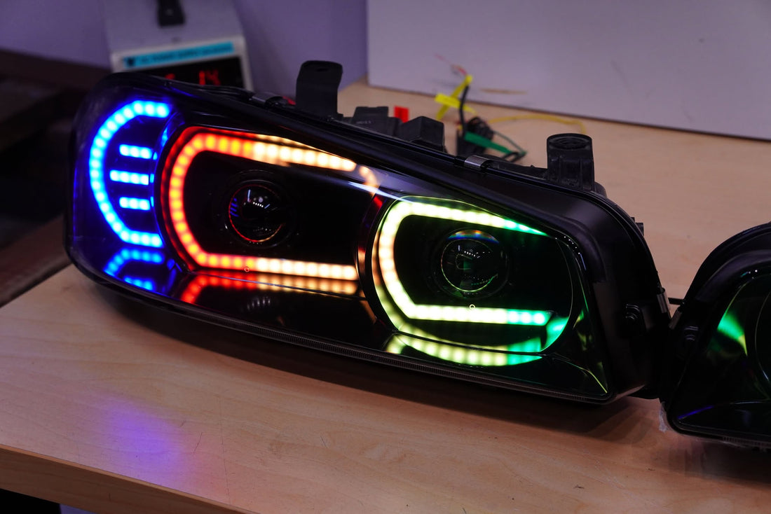Genuine Nissan Skyline R34 GT & GT-T Headlights with Multicoloured Chasing DRLs and Projectors