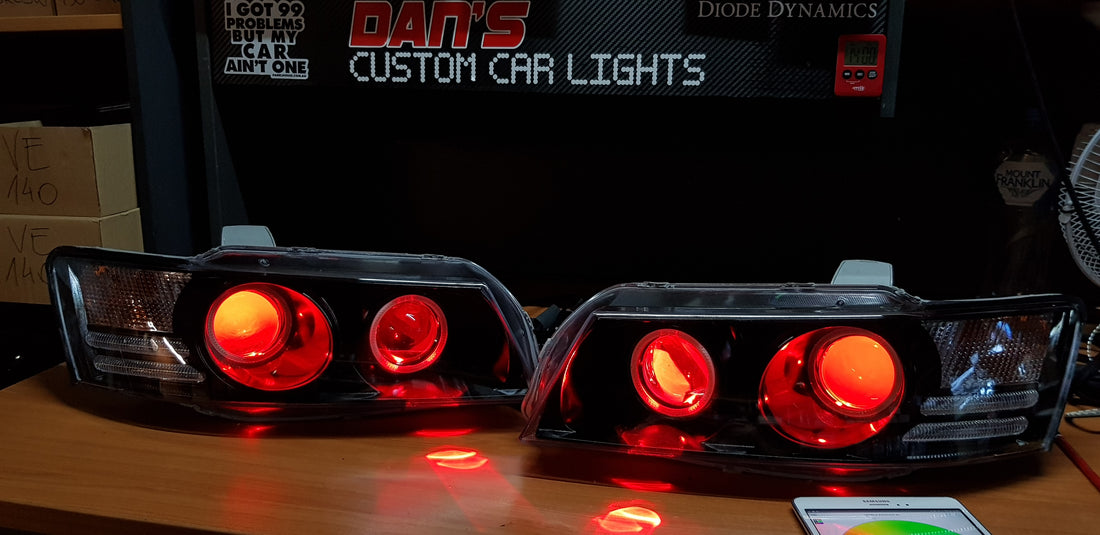 Holden VZ Commodore Projector Headlights with Multicolored Halo Rings and Demon Eyes - Dan's Custom Car Lights 