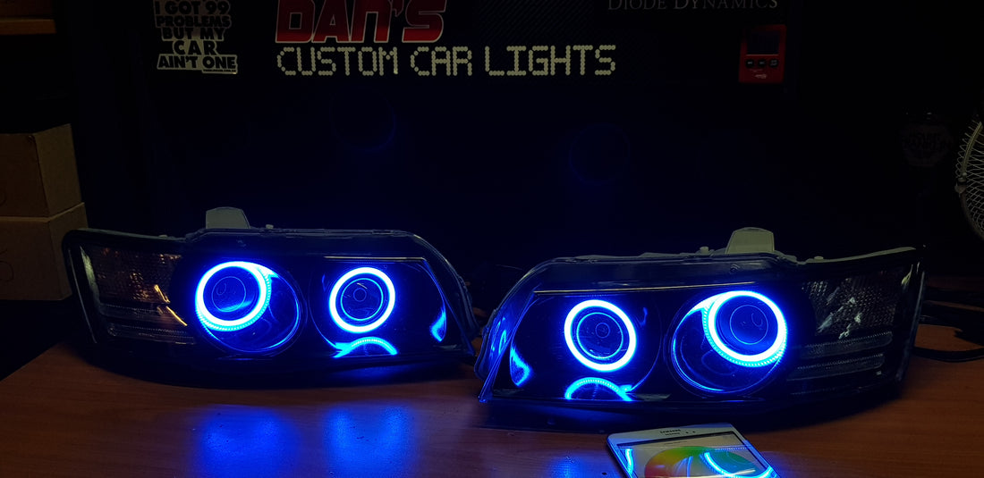 Holden VZ Commodore Projector Headlights with Multicolored Halo Rings and Demon Eyes - Dan's Custom Car Lights 