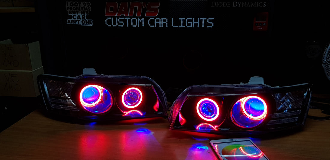 Holden VZ Commodore Projector Headlights with Multicolored Halo Rings and Demon Eyes - Dan's Custom Car Lights 