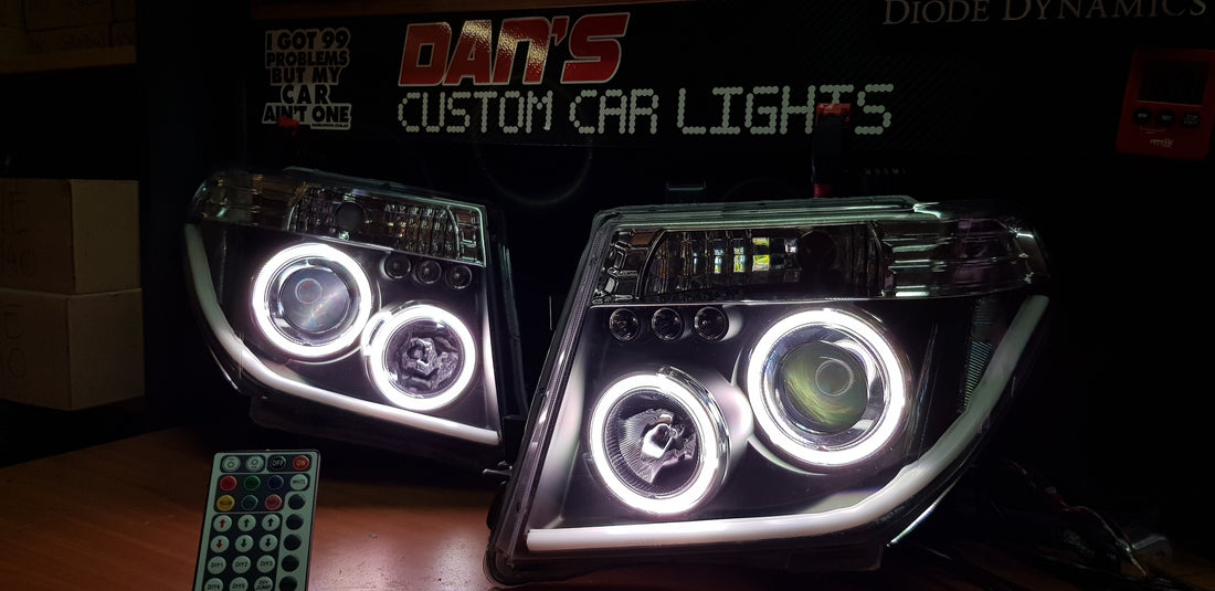 Nissan Navara D40 THAI Pathfinder Headlights with Quad Multicolored Halo Rings - Dan's Custom Car Lights 