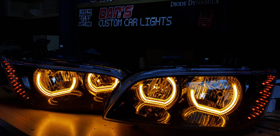 Holden VE Commodore S2 with White/Orange Halo Rings with optical cover and Custom LED Indicator - Dan's Custom Car Lights 