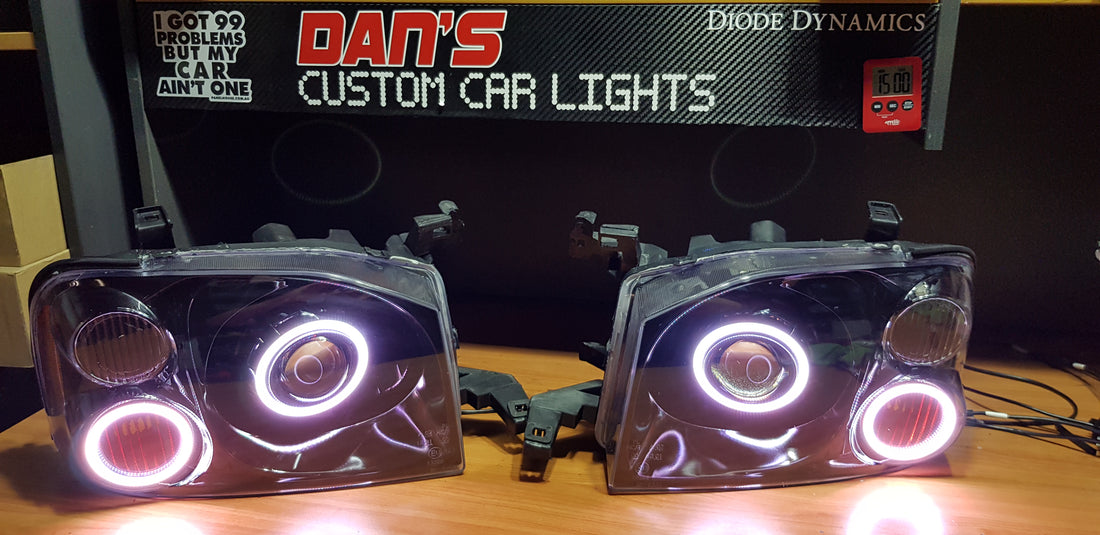 Nissan Navarra D22 Headlights with Quad Multicoloured Halo Rings - Dan's Custom Car Lights 