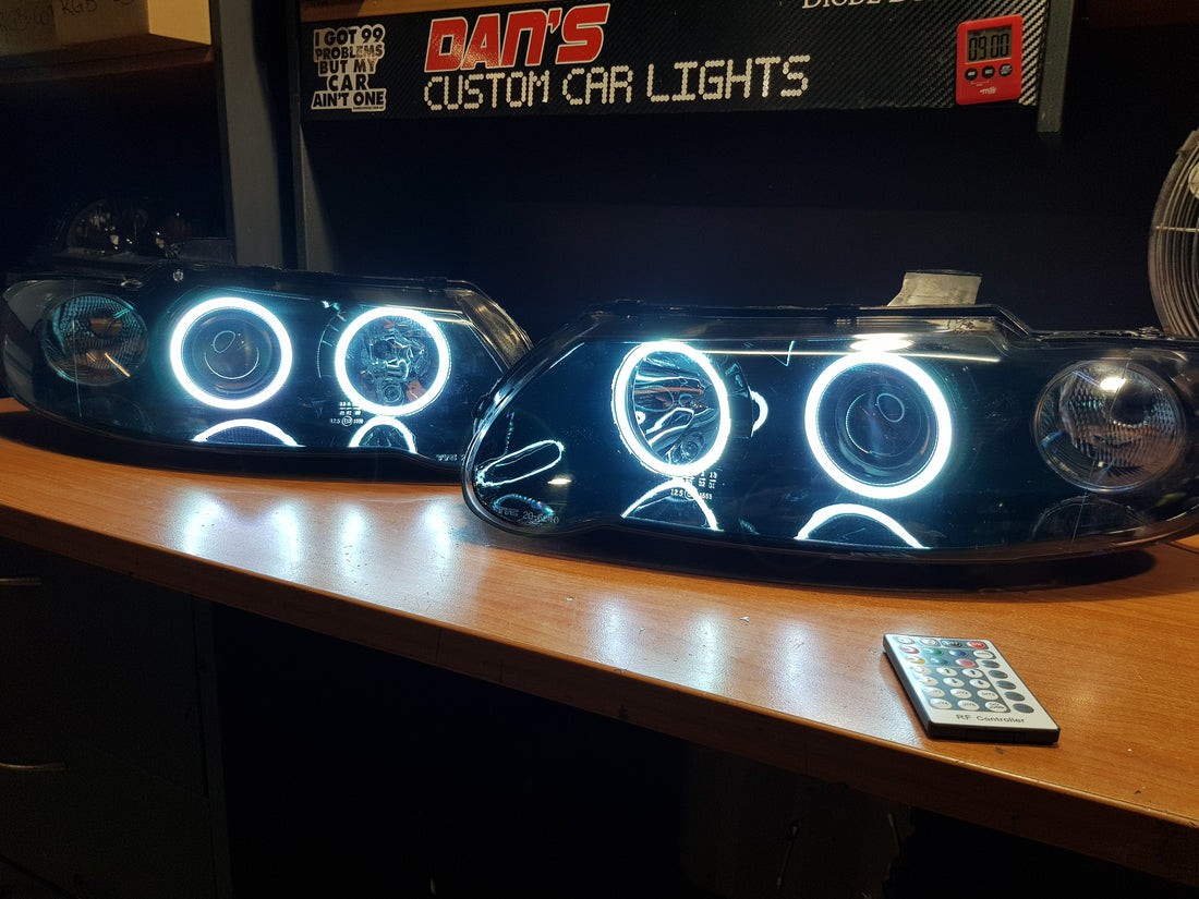 Holden VX VU Altezza Headlights with Multicolored Halo Rings - Dan's Custom Car Lights 