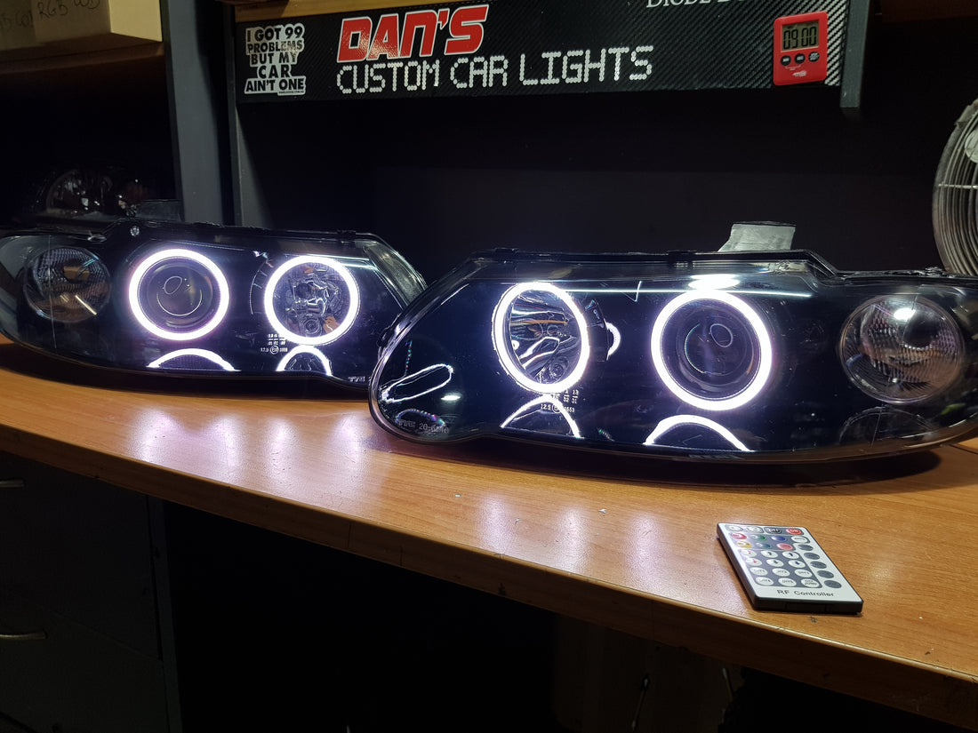 Holden VX VU Altezza Headlights with Multicolored Halo Rings - Dan's Custom Car Lights 