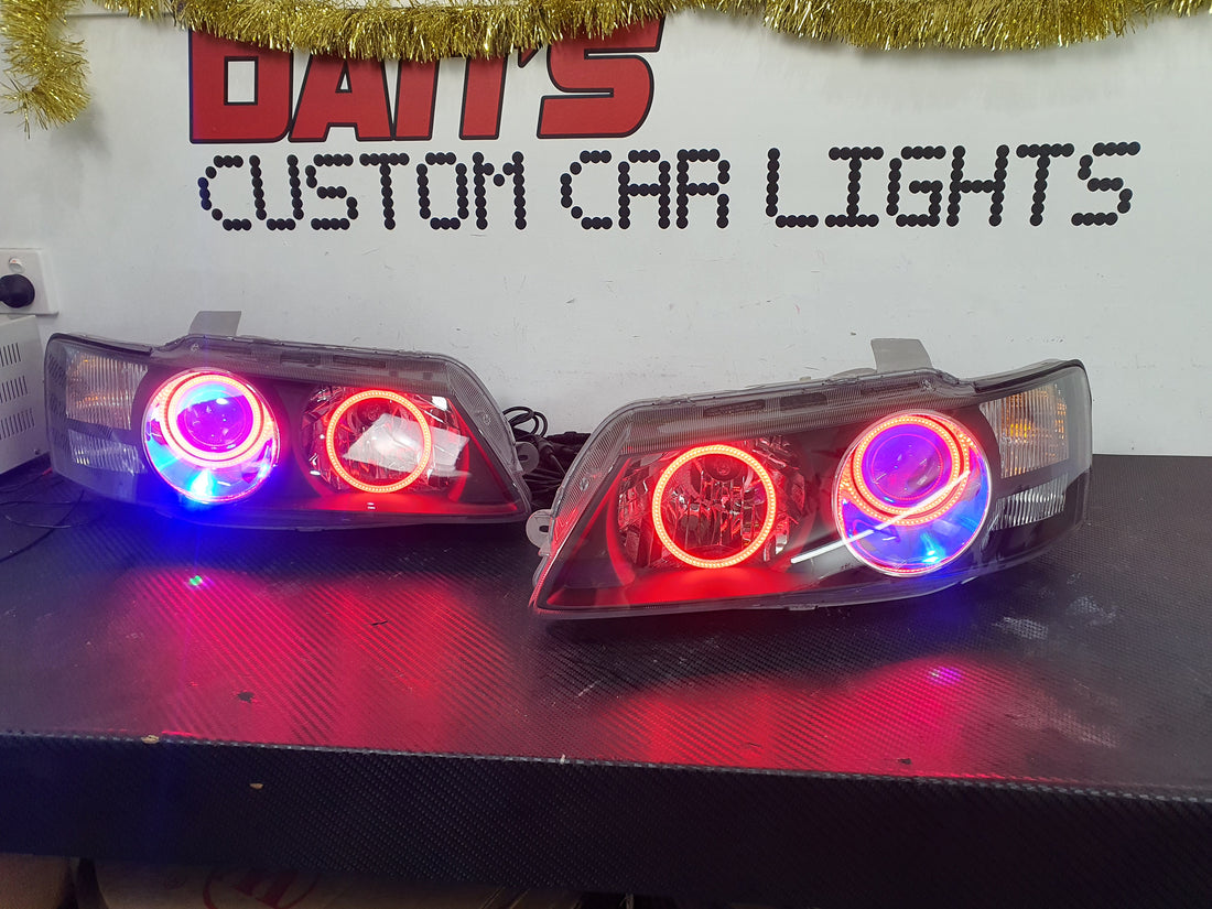 Holden VZ Commodore Projector Headlights with Multicolored Halorings and Demon Eyes - Dan's Custom Car Lights 