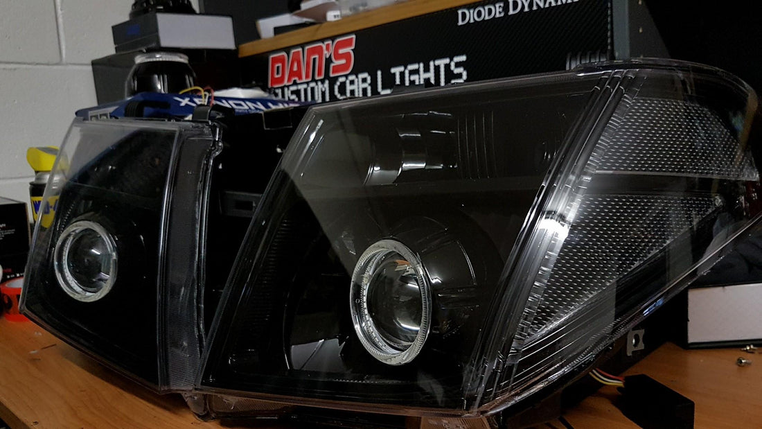 Nissan Navara D40 Thai Headlights Blacked out with Halo Rings and Projectors - Dan's Custom Car Lights 