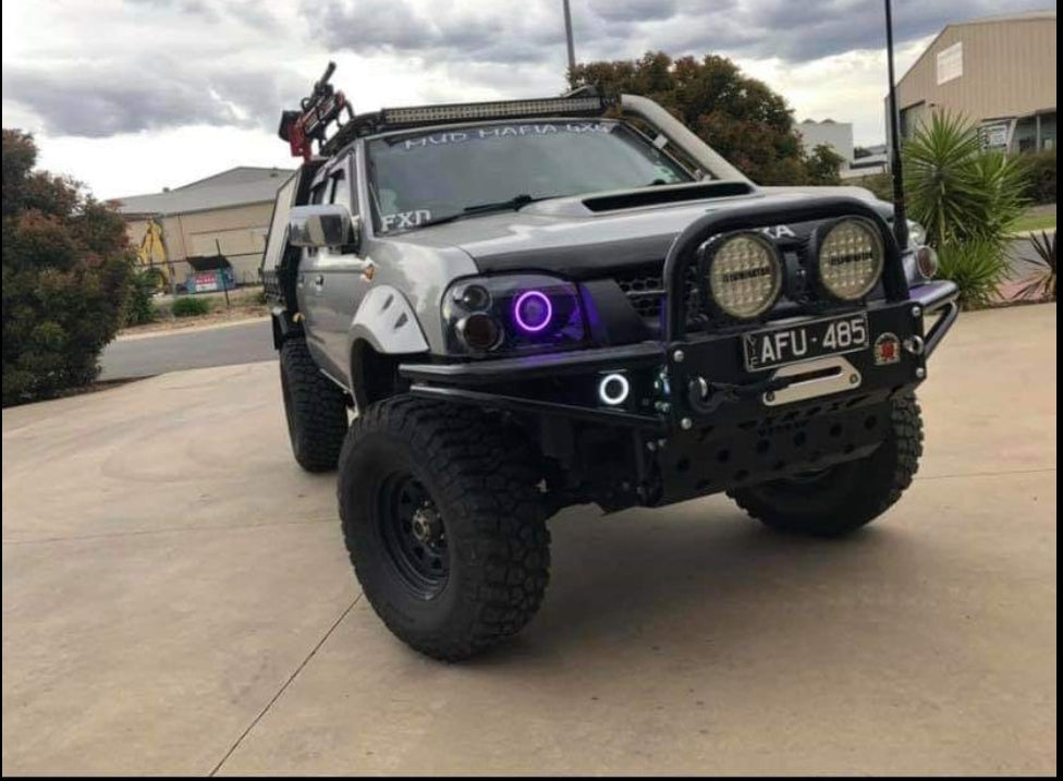 Nissan Navarra D22 Headlights with Multicoloured Halo Rings - Dan's Custom Car Lights 