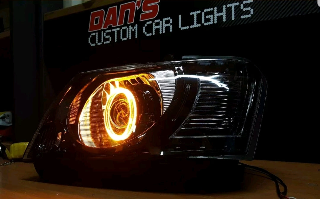 Nissan Patrol GU S4 Headlights with White/Amber Halo Rings and Projectors - Dan's Custom Car Lights 