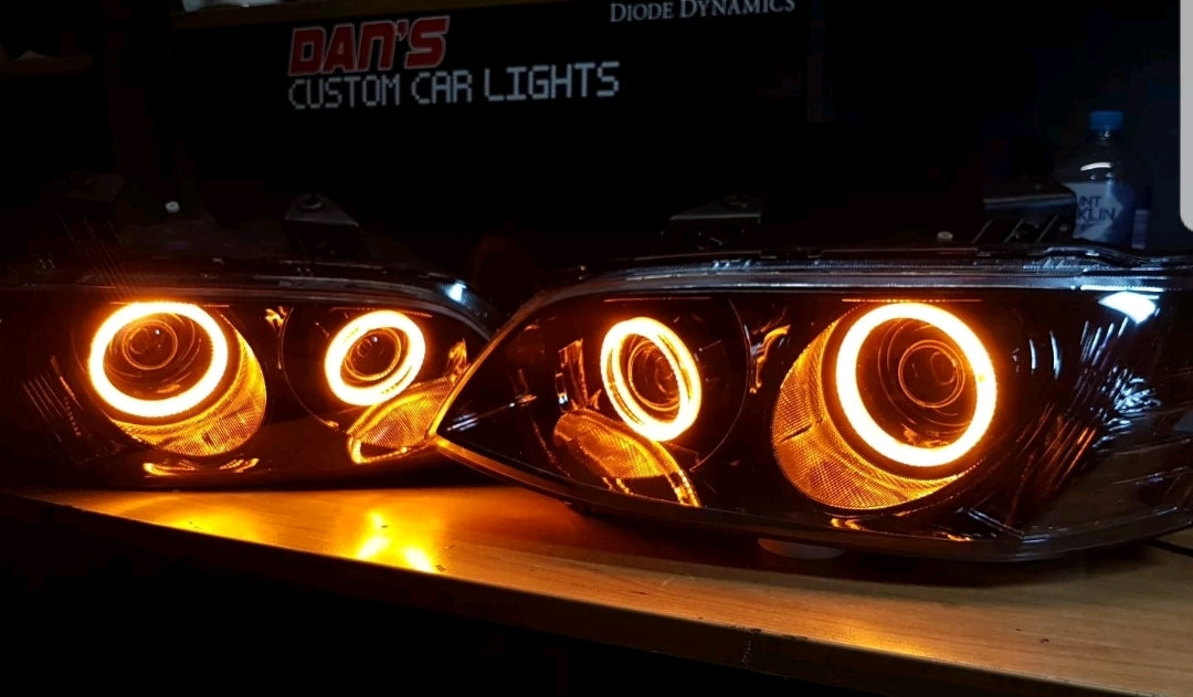 Holden VE Commodore S2 Headlights with Quad Projectors and White/Amber Halo Rings - Dan's Custom Car Lights 