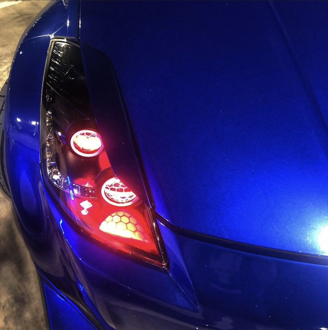 Nissan 350Z Headlights with Multicoloured Halo Rings, Demon Eyes and "Honeycomb" Projector Lens Etching - Dan's Custom Car Lights 