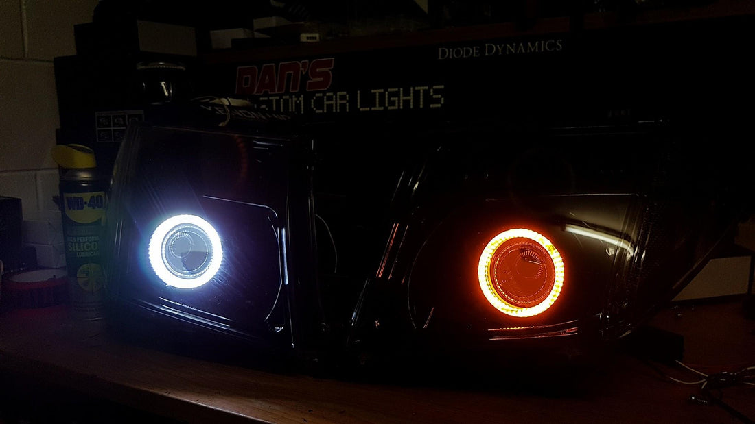 Nissan Navara D40 Thai Headlights Blacked out with Halo Rings and Projectors - Dan's Custom Car Lights 