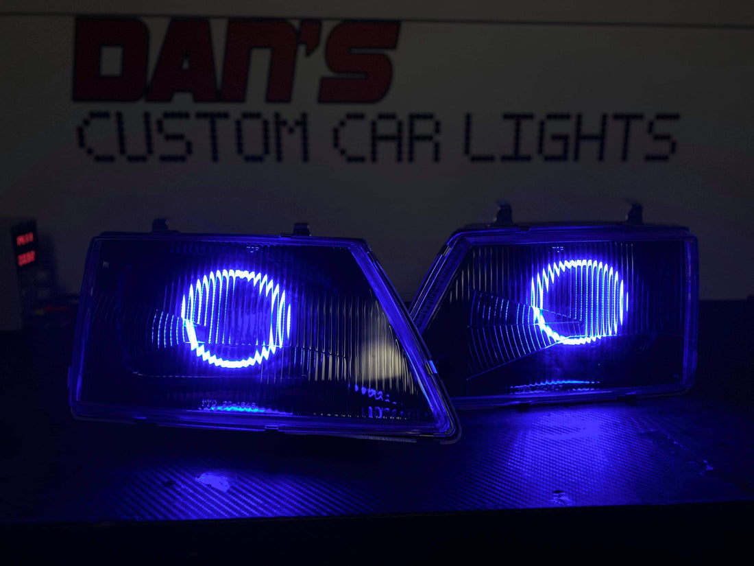 Holden VH Commodore With Projectors And Multicoloured Halo Rings Blacked Out - Dan's Custom Car Lights 
