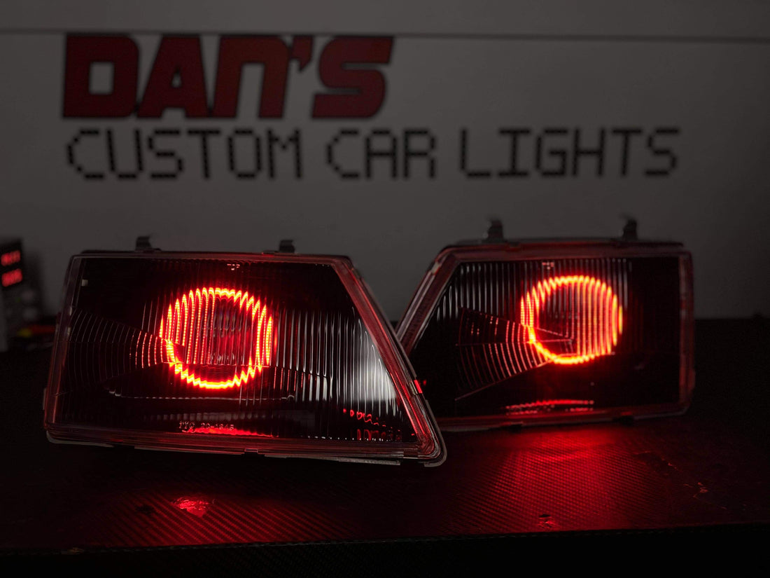 Holden VH Commodore With Projectors And Multicoloured Halo Rings Blacked Out - Dan's Custom Car Lights 