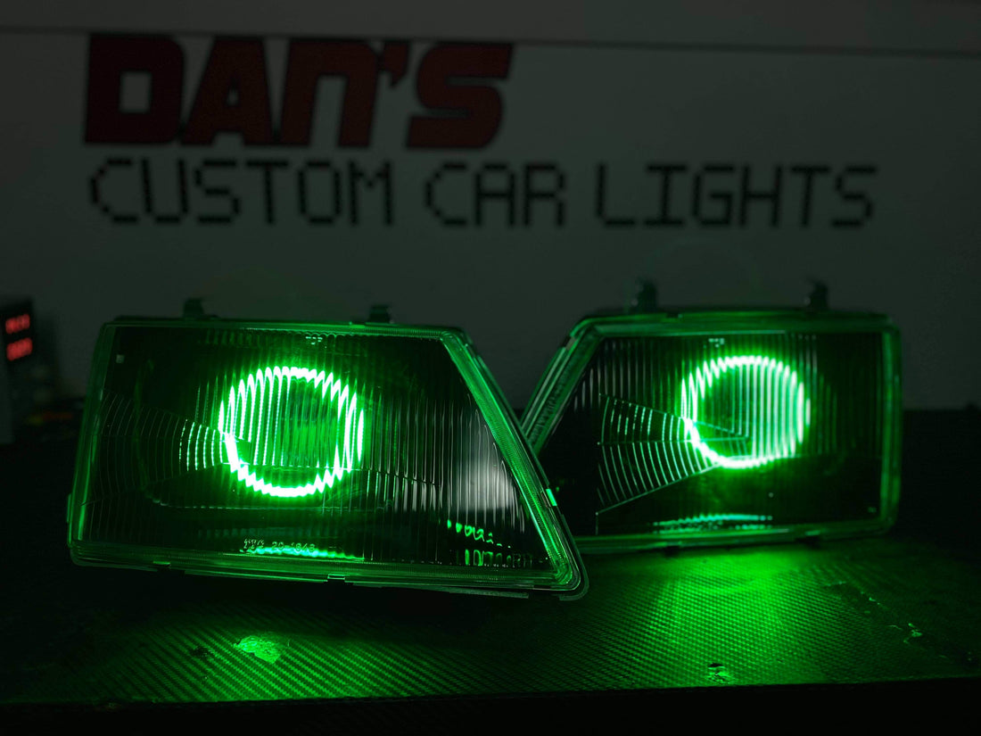 Holden VH Commodore With Projectors And Multicoloured Halo Rings Blacked Out - Dan's Custom Car Lights 