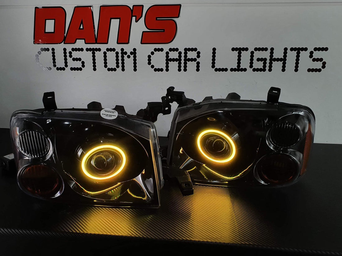 Nissan Navarra D22 Headlights with Multicoloured Halo Rings - Dan's Custom Car Lights 